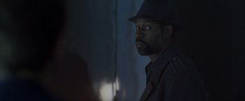 Movie still from “The Thirteenth Floor” (1999), directed by Josef Rusnak – A man wearing a hat and a jacket; Close Up shot, Over the shoulder angle