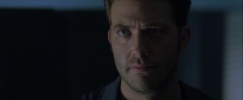 Movie still from “The Thirteenth Floor” (1999), directed by Josef Rusnak – A man's face in the dark; Close Up shot, Low angle