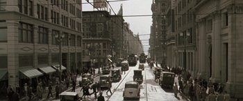 Movie still from “The Thirteenth Floor” (1999), directed by Josef Rusnak – An old photo of a busy city street with cars and pedestrians; Extreme Wide shot, High angle