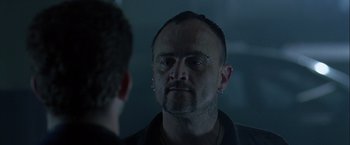 Movie still from “The Thirteenth Floor” (1999), directed by Josef Rusnak – A man looking at himself in the mirror; Close Up shot, Over the shoulder angle