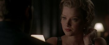Movie still from “The Thirteenth Floor” (1999), directed by Josef Rusnak – A person with short blonde hair; Close Up shot, Over the shoulder angle