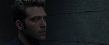 Movie still from “The Thirteenth Floor” (1999), directed by Josef Rusnak – A person looking to his left; Close Up shot, Over the shoulder angle