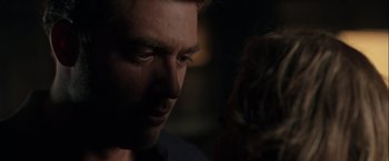 Movie still from “The Thirteenth Floor” (1999), directed by Josef Rusnak – A man's face in the dark; Close Up shot, Over the shoulder angle