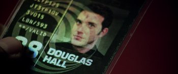 Movie still from “The Thirteenth Floor” (1999), directed by Josef Rusnak – Picture of a man's face on a card; Extreme Close Up shot, Overhead angle