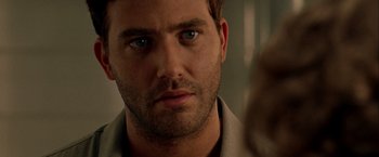 Movie still from “The Thirteenth Floor” (1999), directed by Josef Rusnak – A man's face in a room; Close Up shot, Over the shoulder angle