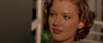 Movie still from “The Thirteenth Floor” (1999), directed by Josef Rusnak – A woman's face in a room; Close Up shot, Over the shoulder angle