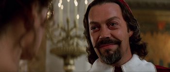 Movie still from “The Three Musketeers” (1993), directed by Stephen Herek – A person with a beard; Close Up shot, Over the shoulder angle