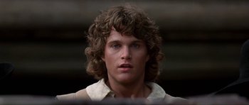 Movie still from “The Three Musketeers” (1993), directed by Stephen Herek – A person wearing a white shirt; Close Up shot, Low angle