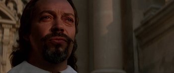 Movie still from “The Three Musketeers” (1993), directed by Stephen Herek – A person with long hair and a beard; Close Up shot, Low angle