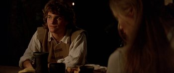 Movie still from “The Three Musketeers” (1993), directed by Stephen Herek – A man sitting in front of a woman at a dinner table; Medium shot, Over the shoulder angle