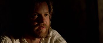 Movie still from “The Three Musketeers” (1993), directed by Stephen Herek – A person with a beard; Close Up shot, Over the shoulder angle