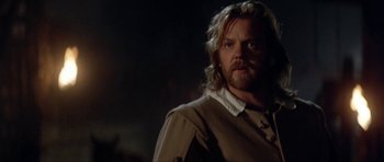 Movie still from “The Three Musketeers” (1993), directed by Stephen Herek – A person with long blonde hair; Close Up shot, Over the shoulder angle
