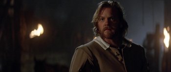 Movie still from “The Three Musketeers” (1993), directed by Stephen Herek – A person with long blonde hair; Close Up shot, Over the shoulder angle