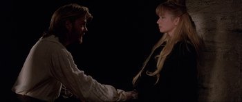 Movie still from “The Three Musketeers” (1993), directed by Stephen Herek – A man and a woman holding each other's hands; Medium shot, Over the shoulder angle