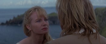 Movie still from “The Three Musketeers” (1993), directed by Stephen Herek – A woman looking into a mirror while standing next to a man; Close Up shot, Over the shoulder angle