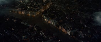 Movie still from “The Three Musketeers” (2011), directed by Paul W.S. Anderson – An aerial view of a flooded city at night; Extreme Wide shot, Overhead angle
