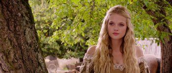 Movie still from “The Three Musketeers” (2011), directed by Paul W.S. Anderson – A beautiful young lady with long blonde hair; Close Up shot, Over the shoulder angle