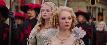 Movie still from “The Three Musketeers” (2011), directed by Paul W.S. Anderson – Two women in medieval dress standing next to each other; Close Up shot, Over the shoulder angle