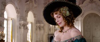 Movie still from “The Three Musketeers” (2011), directed by Paul W.S. Anderson – A woman in a black hat and a necklace; Close Up shot, Low angle