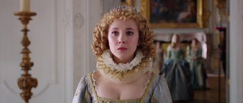 Movie still from “The Three Musketeers” (2011), directed by Paul W.S. Anderson – A young woman in a medieval dress with a tiara; Close Up shot, Over the shoulder angle