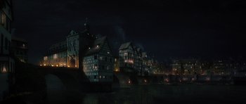 Movie still from “The Three Musketeers” (2011), directed by Paul W.S. Anderson – A dark night with a bridge and some buildings; Extreme Wide shot, High angle