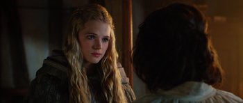 Movie still from “The Three Musketeers” (2011), directed by Paul W.S. Anderson – A young woman with long blonde hair looking into the mirror; Close Up shot, Over the shoulder angle