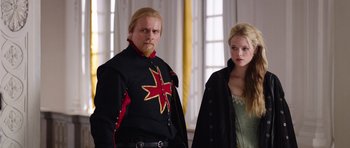 Movie still from “The Three Musketeers” (2011), directed by Paul W.S. Anderson – A man and a woman dressed in medieval clothing; Medium shot, Over the shoulder angle