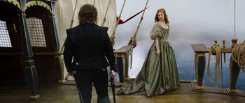 Movie still from “The Three Musketeers” (2011), directed by Paul W.S. Anderson – A man and a woman dressed in medieval clothing; Wide shot, Over the shoulder angle