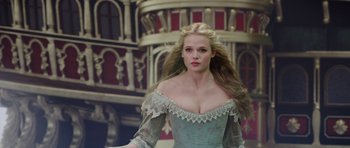 Movie still from “The Three Musketeers” (2011), directed by Paul W.S. Anderson – A woman with long blonde hair wearing a blue dress; Medium shot, Low angle
