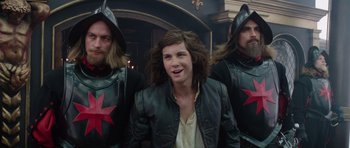 Movie still from “The Three Musketeers” (2011), directed by Paul W.S. Anderson – A group of men standing next to each other; Medium shot, Over the shoulder angle