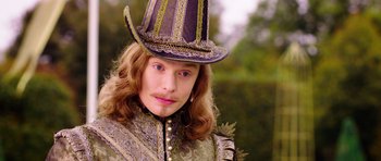 Movie still from “The Three Musketeers” (2011), directed by Paul W.S. Anderson – A person wearing a hat; Close Up shot, Over the shoulder angle