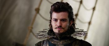 Movie still from “The Three Musketeers” (2011), directed by Paul W.S. Anderson – A person wearing a costume; Close Up shot, Over the shoulder angle