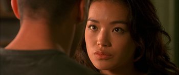 Movie still from “The Transporter” (2002), directed by Corey Yuen – A woman's face and a man's face; Close Up shot, Over the shoulder angle