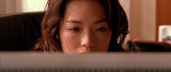 Movie still from “The Transporter” (2002), directed by Corey Yuen – A person using a computer keyboard; Close Up shot, Low angle