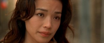 Movie still from “The Transporter” (2002), directed by Corey Yuen – A young woman's face; Close Up shot, Over the shoulder angle