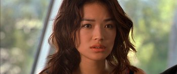 Movie still from “The Transporter” (2002), directed by Corey Yuen – A person with long hair; Close Up shot, Low angle