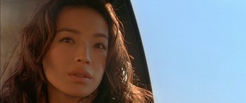 Movie still from “The Transporter” (2002), directed by Corey Yuen – A woman's face in a vehicle; Close Up shot, Low angle