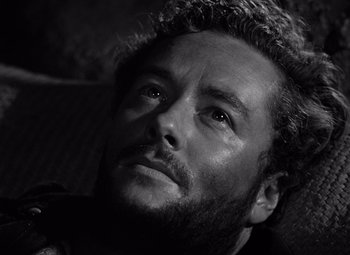 Movie still from “The Treasure of the Sierra Madre” (1948), directed by John Huston – Black and white photograph of a man with a beard; Close Up shot, Low angle