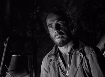 Movie still from “The Treasure of the Sierra Madre” (1948), directed by John Huston – Black and white photograph of a man with a beard; Close Up shot, Low angle