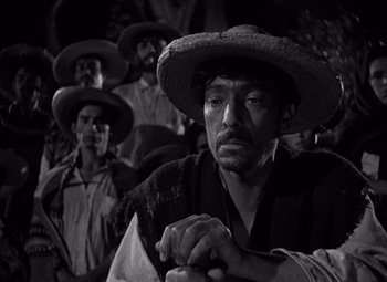 Movie still from “The Treasure of the Sierra Madre” (1948), directed by John Huston – Black and white photograph of a man in a straw hat; Close Up shot, Low angle