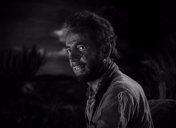 Movie still from “The Treasure of the Sierra Madre” (1948), directed by John Huston – Black and white photograph of a man with a beard; Close Up shot, Low angle