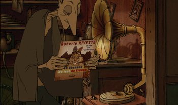 Movie still from “The Triplets of Belleville” (2003), directed by Sylvain Chomet – An old man holding a book in front of a gramaphone; Medium shot, Overhead angle