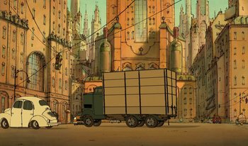 Movie still from “The Triplets of Belleville” (2003), directed by Sylvain Chomet – A truck is driving down the street in front of some buildings; Extreme Wide shot, Low angle