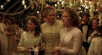Movie still from “The Village” (2004), directed by M. Night Shyamalan – A group of women standing next to each other; Medium shot, High angle