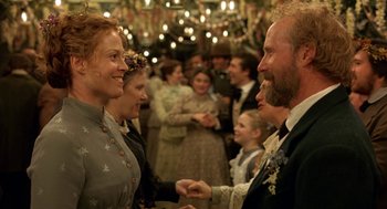 Movie still from “The Village” (2004), directed by M. Night Shyamalan – A couple of people that are talking to each other; Close Up shot, Over the shoulder angle