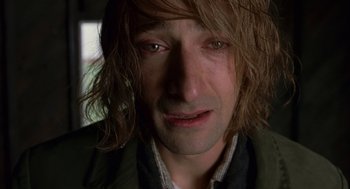 Movie still from “The Village” (2004), directed by M. Night Shyamalan – A person with long hair; Close Up shot, Low angle