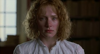 Movie still from “The Village” (2004), directed by M. Night Shyamalan – A person wearing a white shirt; Close Up shot, Low angle