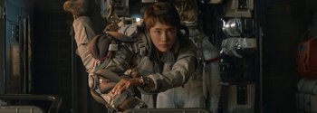 Movie still from “The Wandering Earth II” (2023), directed by Frant Gwo – A woman in a space suit is holding a device; Medium shot, Over the shoulder angle
