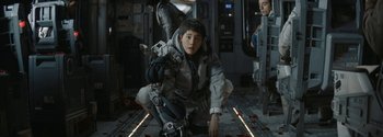 Movie still from “The Wandering Earth II” (2023), directed by Frant Gwo – A woman kneeling down on the ground in a room; Medium shot, Low angle