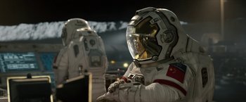 Movie still from “The Wandering Earth II” (2023), directed by Frant Gwo – A man in a spacesuit is standing next to another man in a spacesuit; Medium shot, Low angle